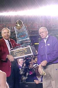 King Snyder accepts the Holiday Bowl trophy